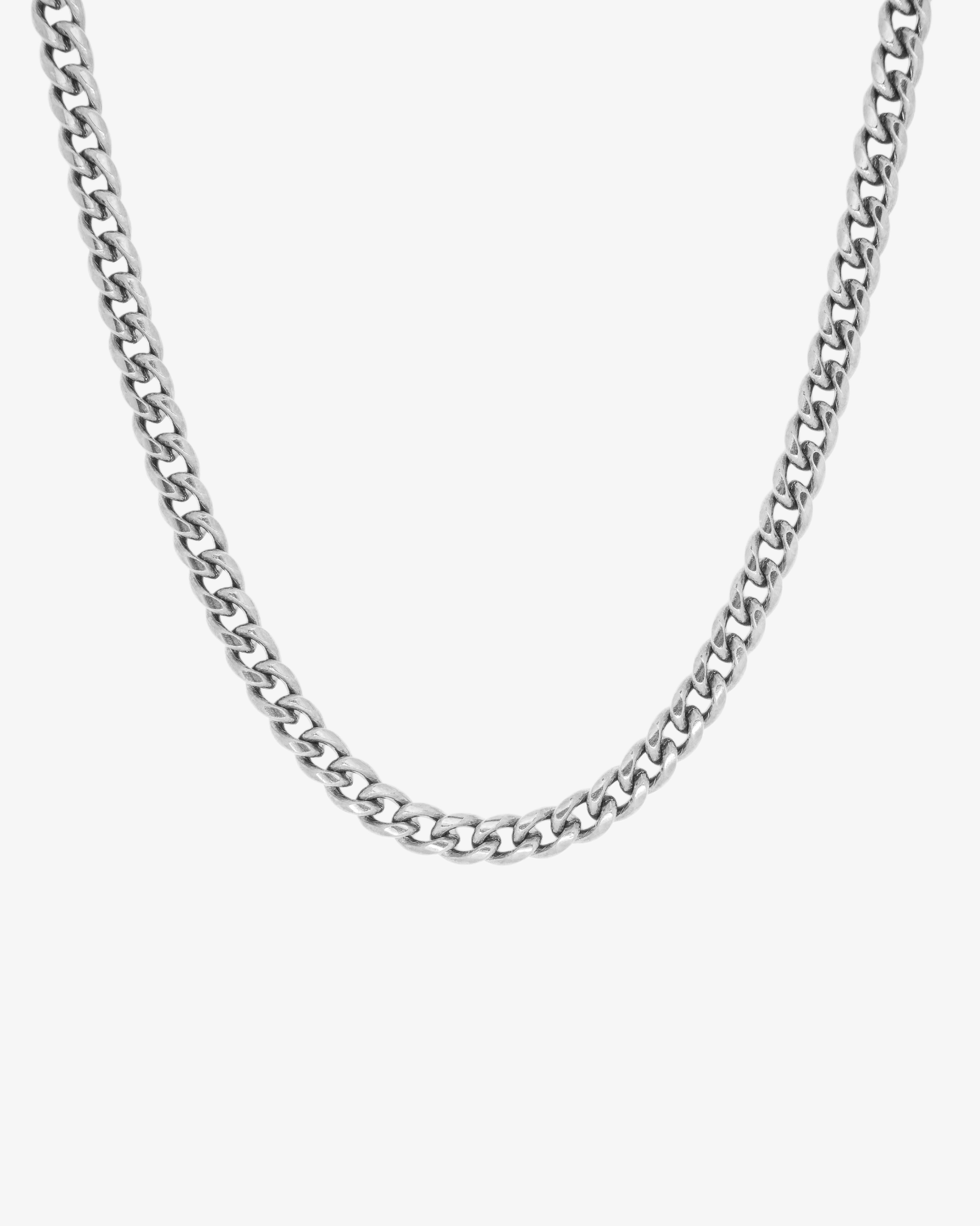 Close-up of a 5mm silver Cuban link chain necklace against a white background.