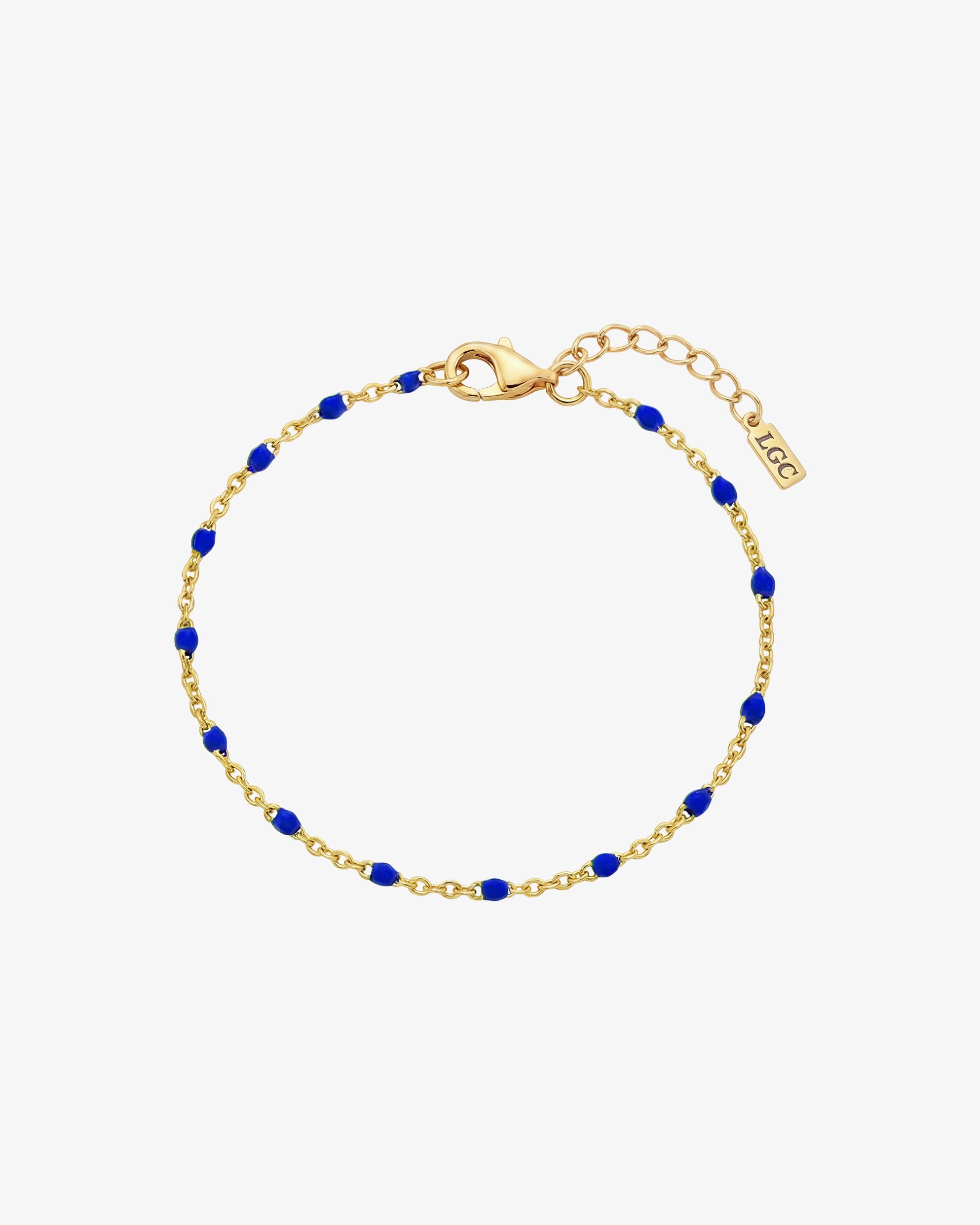 Gem gold bracelet with blue beads spaced along a delicate gold chain