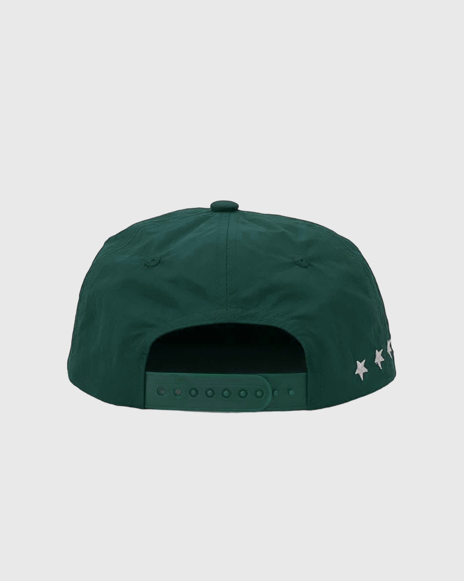 Back view of a green nylon cap with white star embroidery along the side and a snap closure.