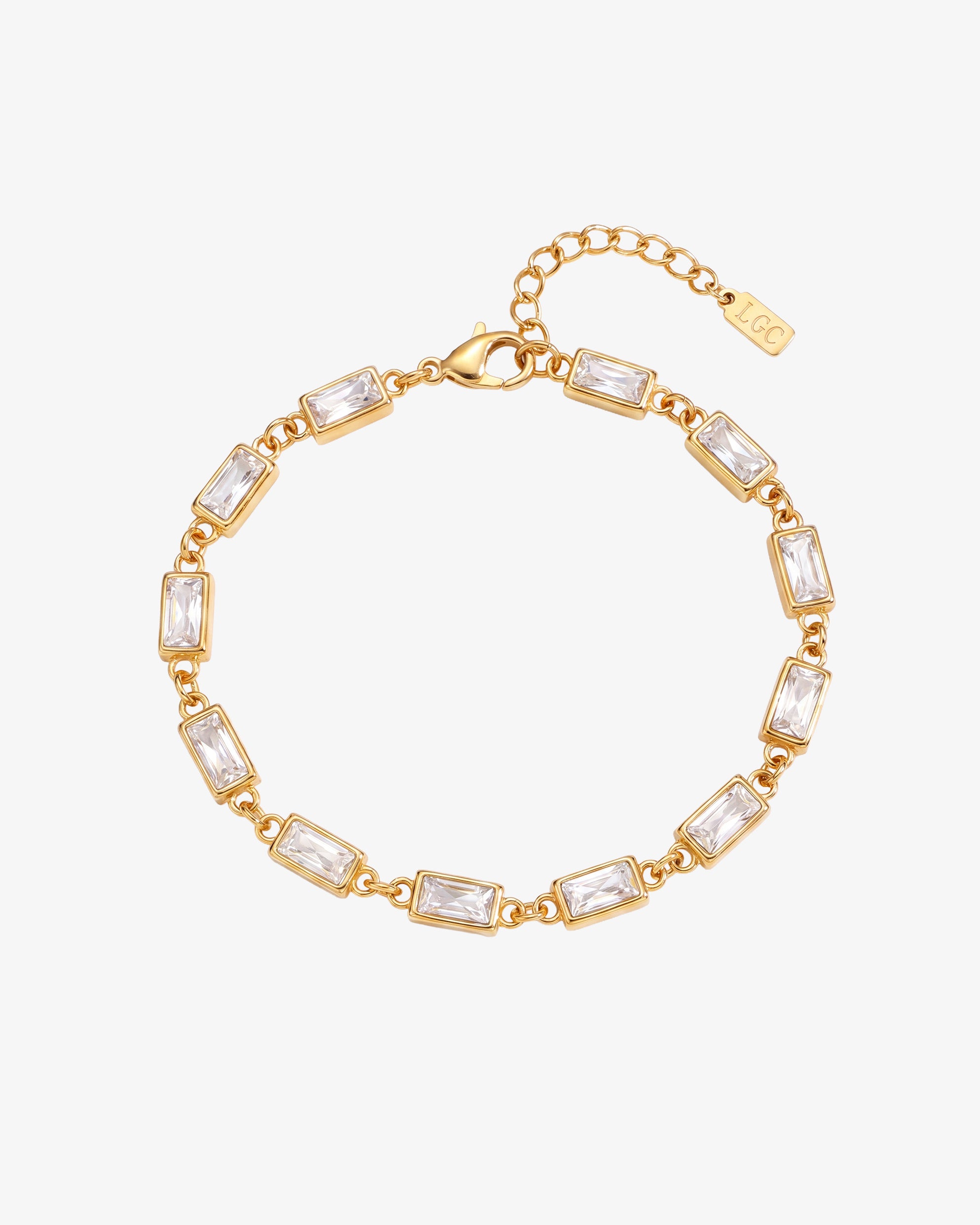 Pulsera dorada OMEN con piedras rectangulares transparentes en engastes dorados y cierre de mosquetón