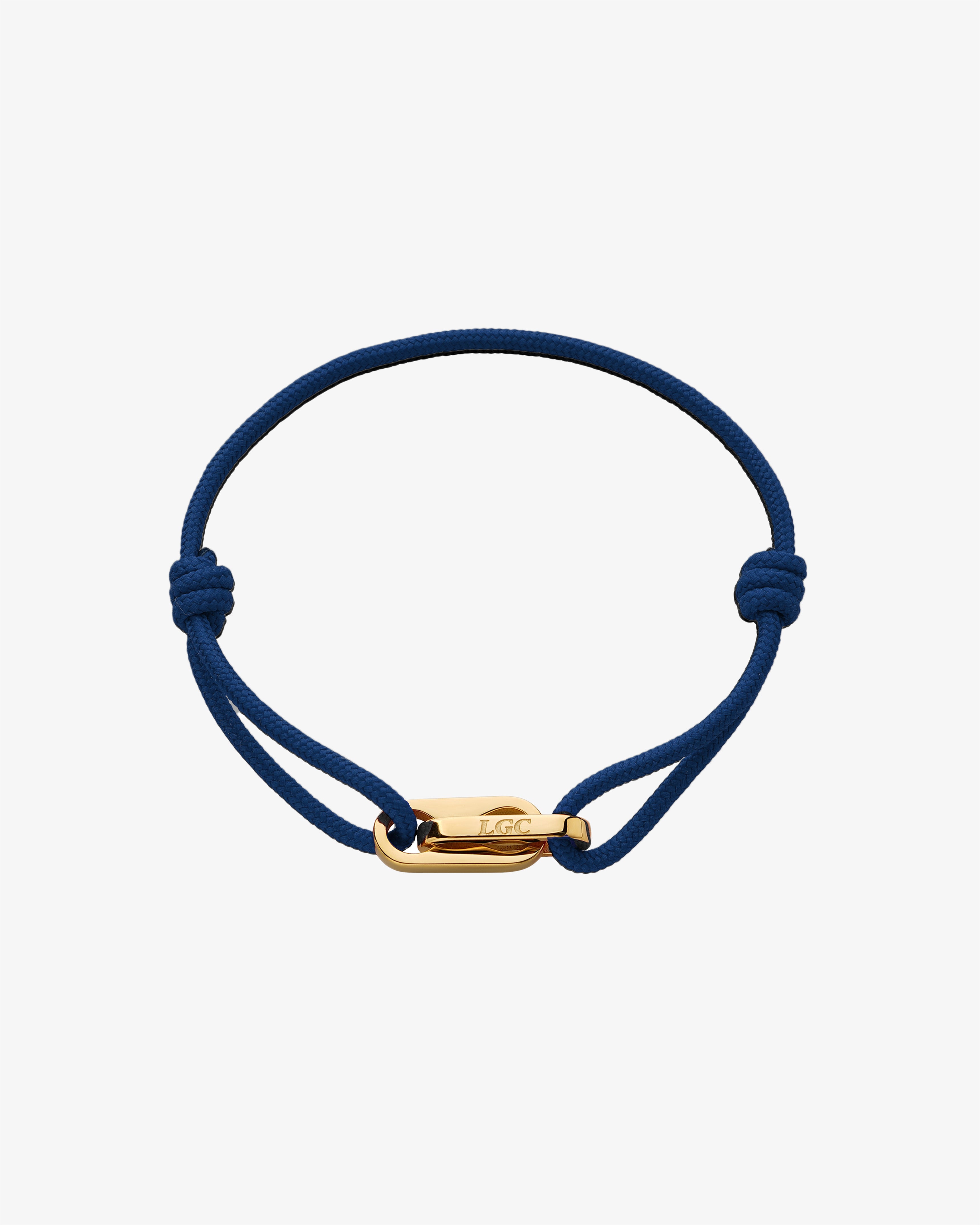 Atlantis Gold Bracelet with a blue braided cord and gold clasp on white background