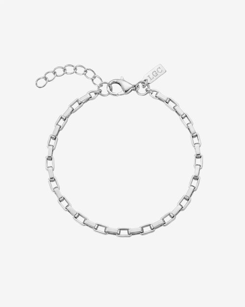 Close-up of silver Capri bracelet on a wrist with rectangular links and a clasp.