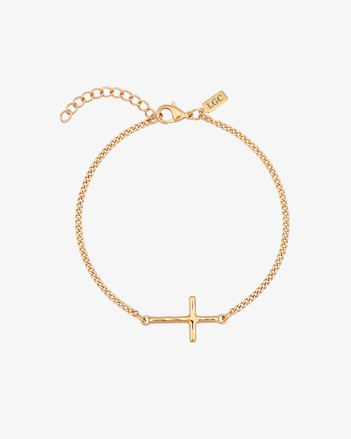 Gold cross bracelet with a slim chain and central cross charm