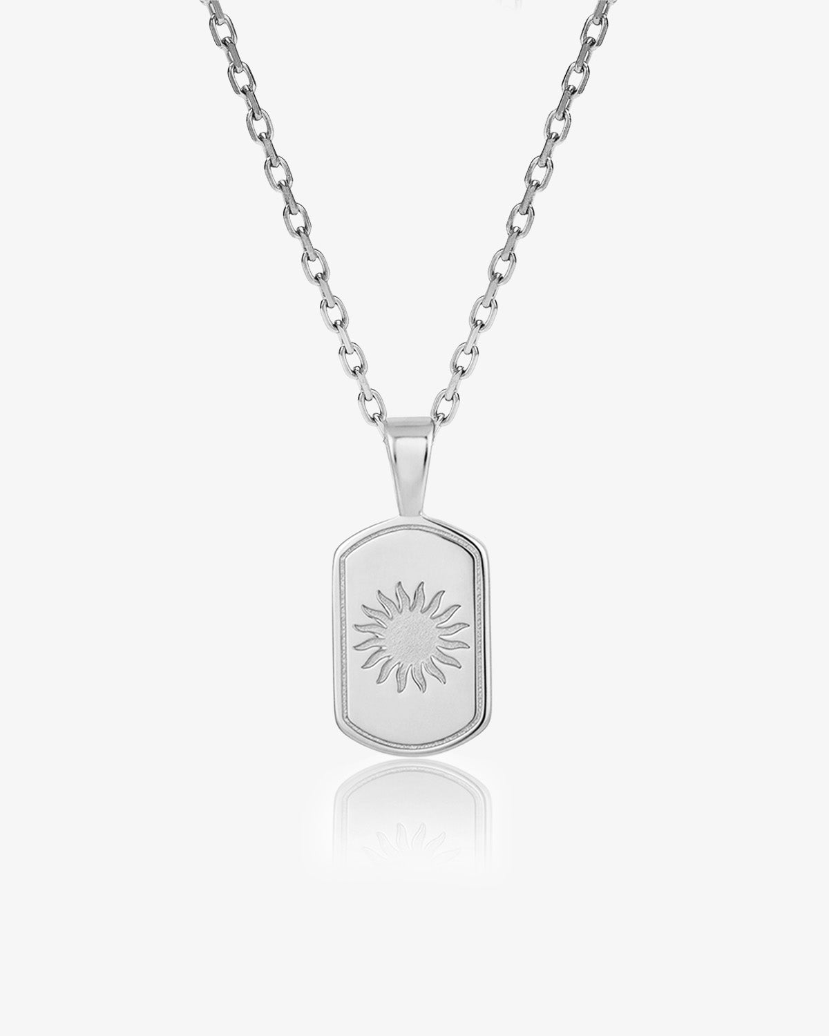 DAYSTAR silver necklace with a rectangular sunburst pendant on a white backdrop