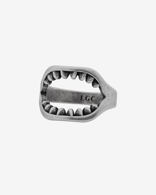 Shark jaw design ring in brushed silver on a finger