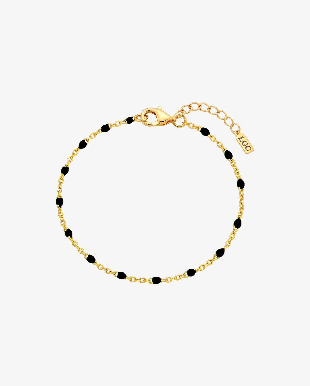 Pulsera dorada GEM con cuentas negras en cadena dorada y cierre de mosquetón