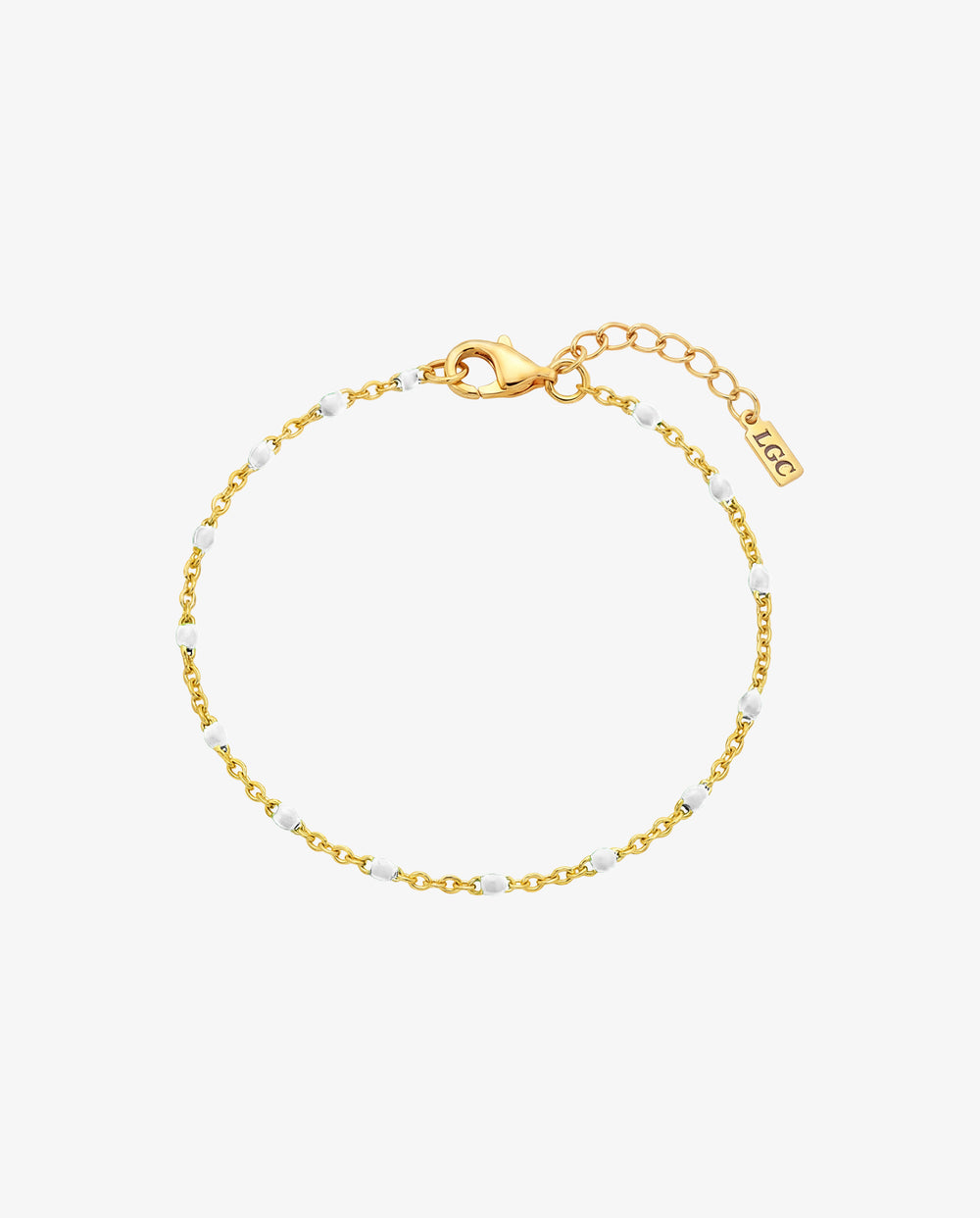 GEM GOLD BRACELET con cuentas blancas en fina cadena dorada y largo ajustable