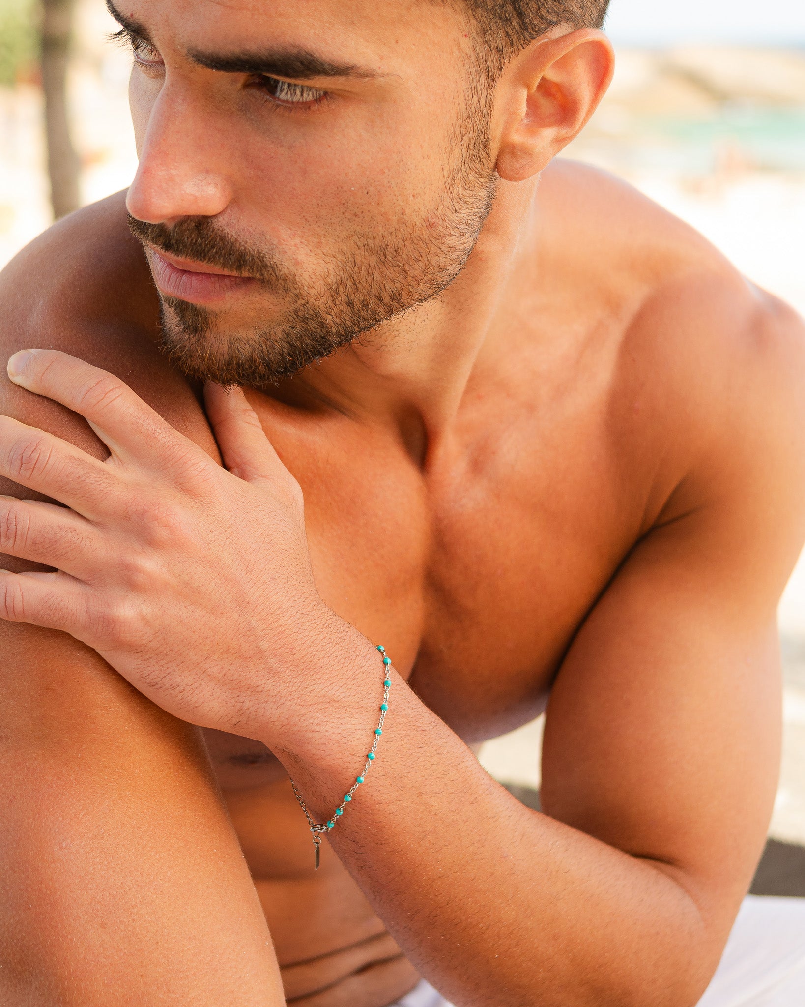 Silver GEM bracelet with turquoise beads worn on a man's wrist