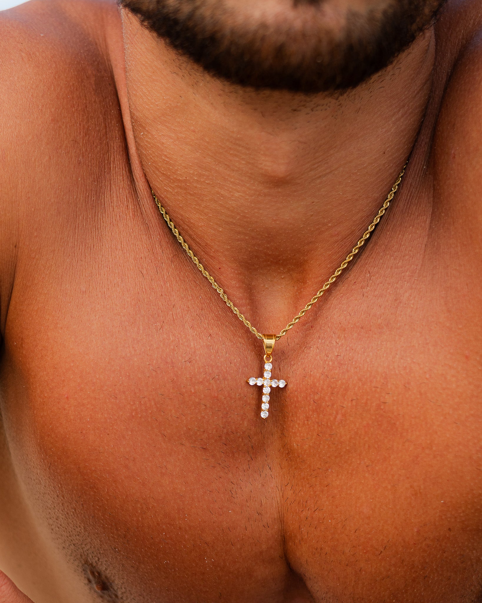 Gold chain with a diamond studded cross pendant