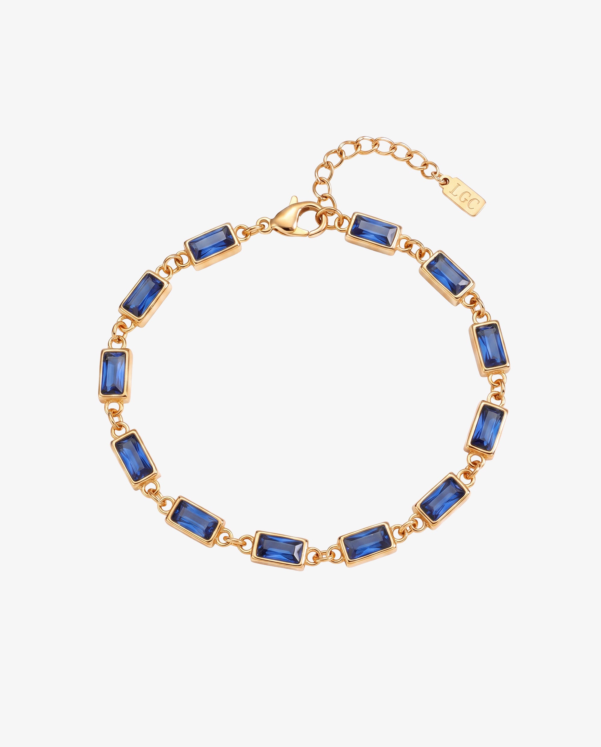 Gold bracelet with blue rectangular stones linked along the chain