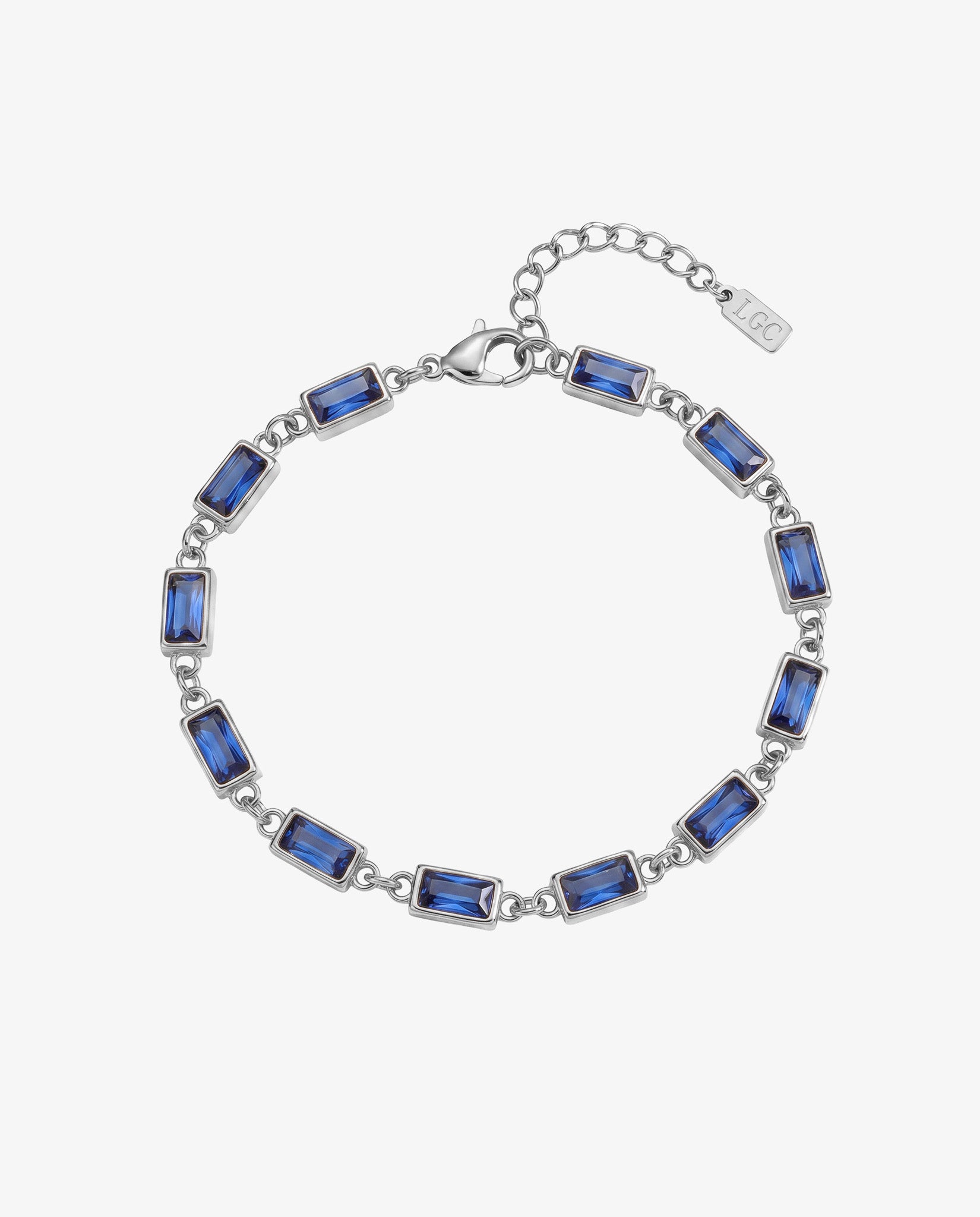 OMEN silver bracelet with blue rectangular stones linked around a wrist on a light background.