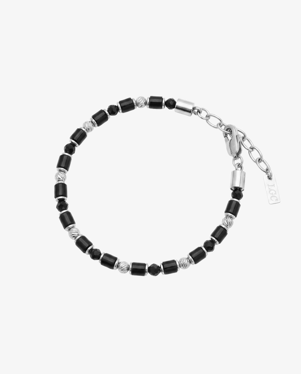 Black agate bead bracelet with silver spacers and clasp against a light background