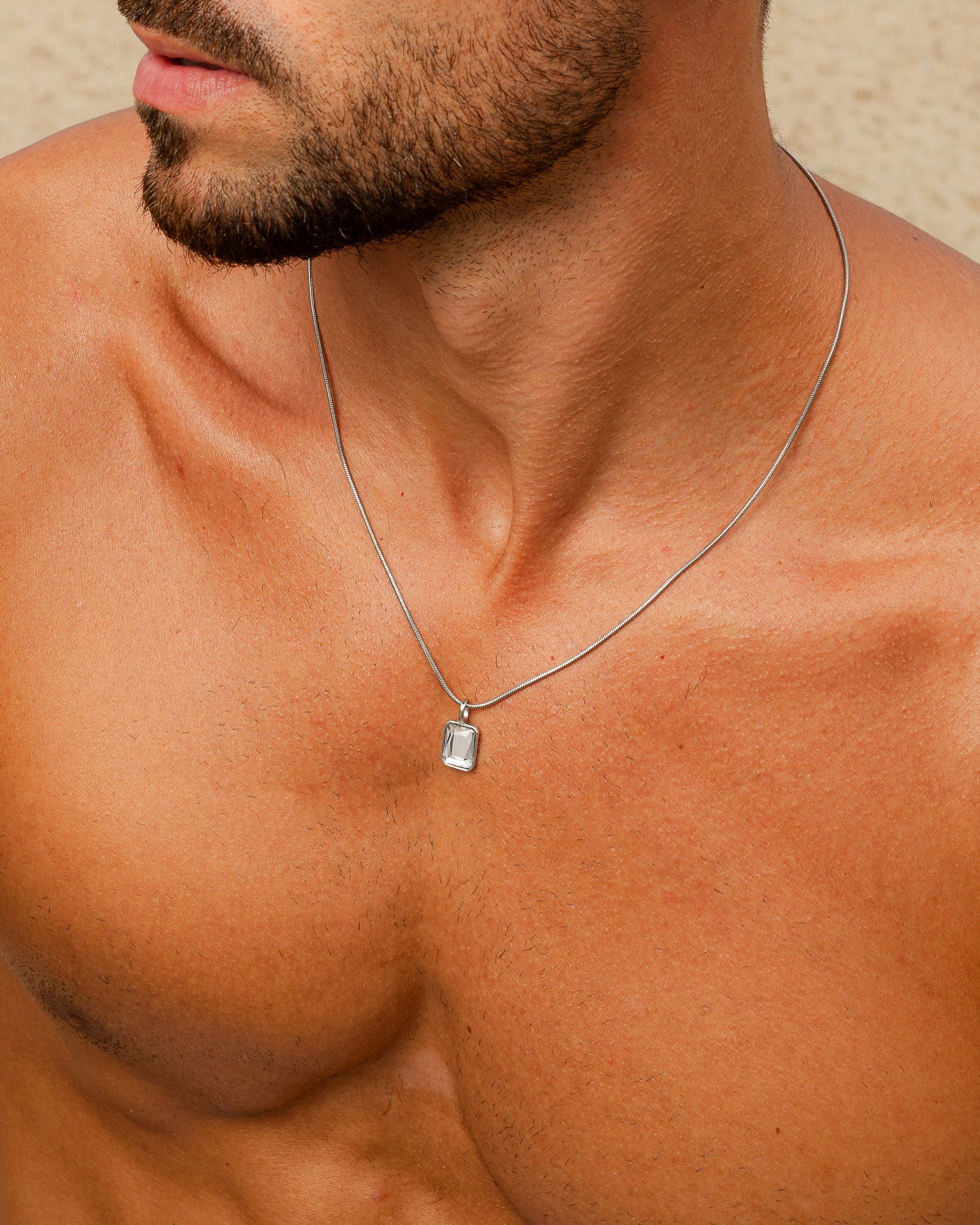 Solstice Silver necklace with a rectangular crystal pendant on a slim silver chain.